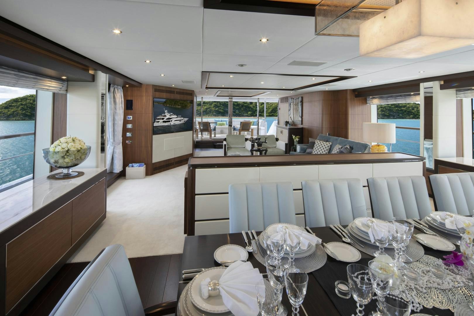 a dining room with a large table aboard JODI ANN Yacht for Sale