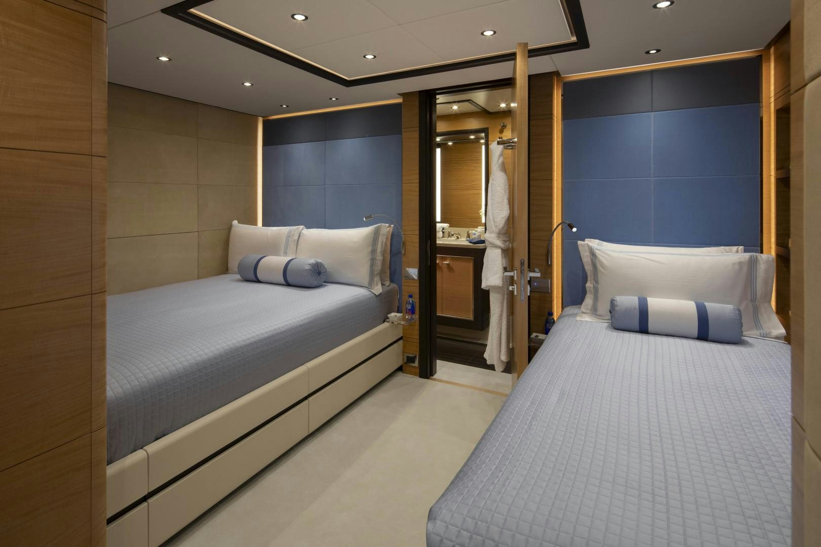a room with a bed and a mirror aboard JODI ANN Yacht for Sale