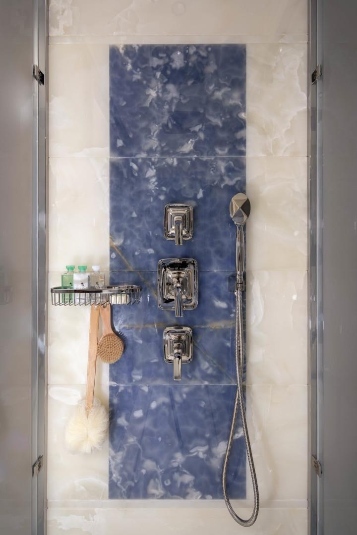 a shower with a blue wall aboard JODI ANN Yacht for Sale