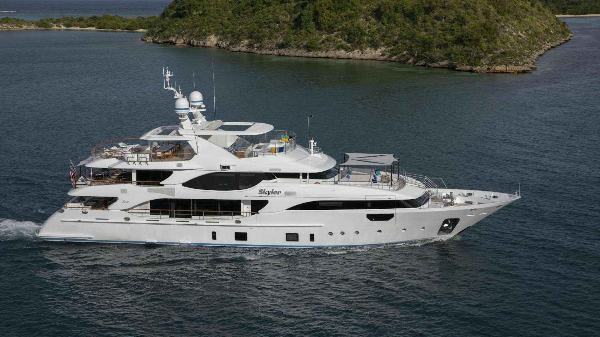a large white yacht on the water aboard Skyler Yacht for Sale
