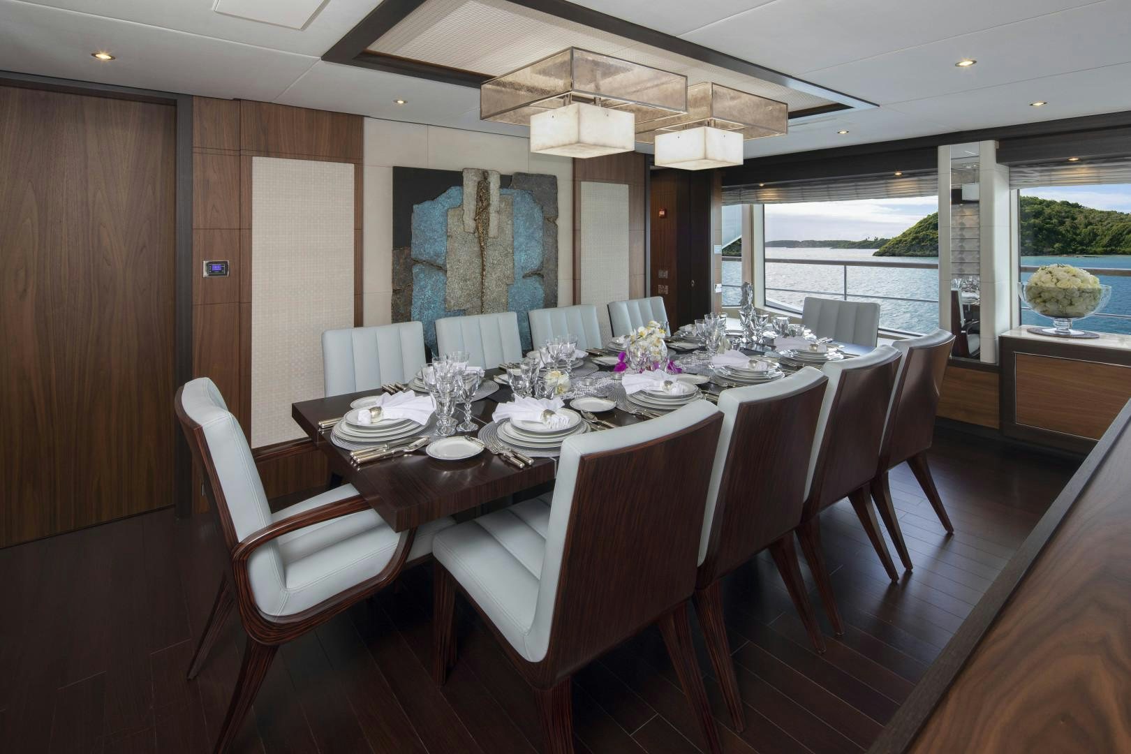 a dining room with a table and chairs aboard JODI ANN Yacht for Sale