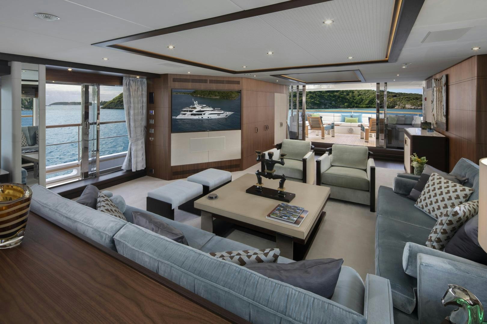 a living room with a large window aboard JODI ANN Yacht for Sale