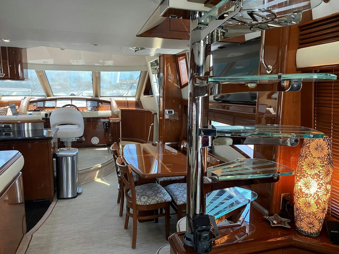 a room with a large wood bunk bed and a large window aboard Gettin' There Yacht for Sale