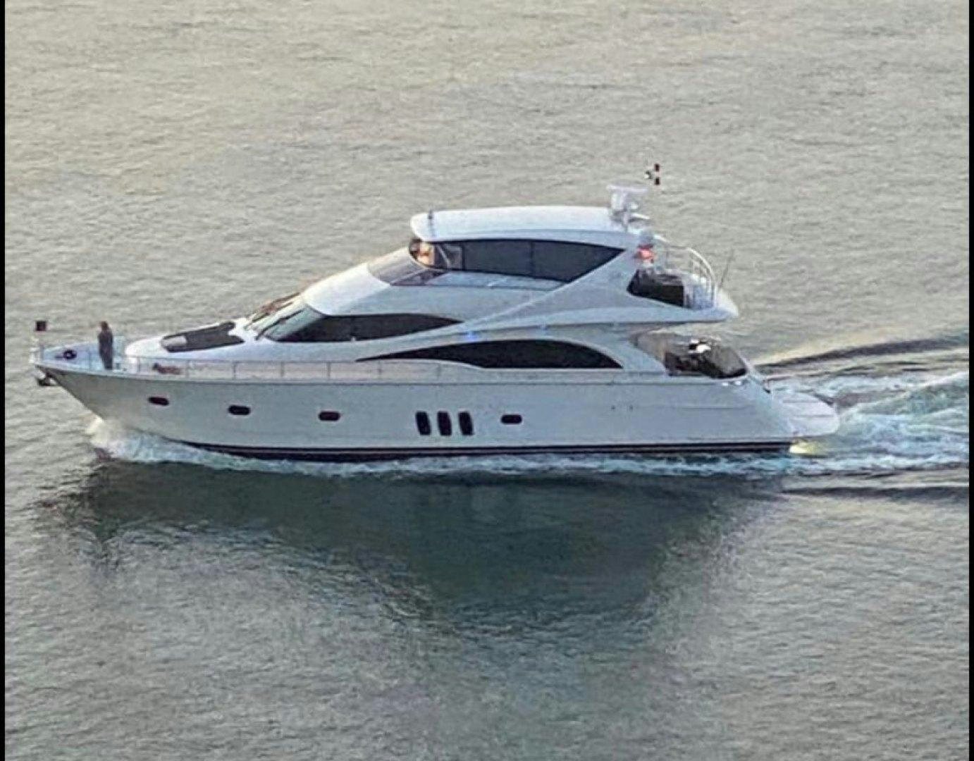 a white yacht on the water aboard Gettin' There Yacht for Sale