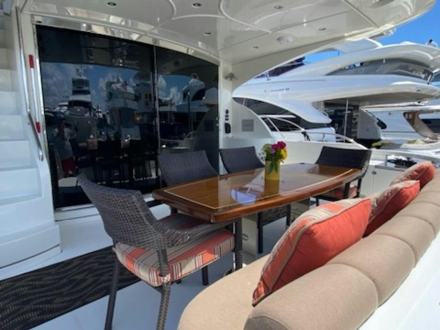 a room with a table and chairs aboard Gettin' There Yacht for Sale
