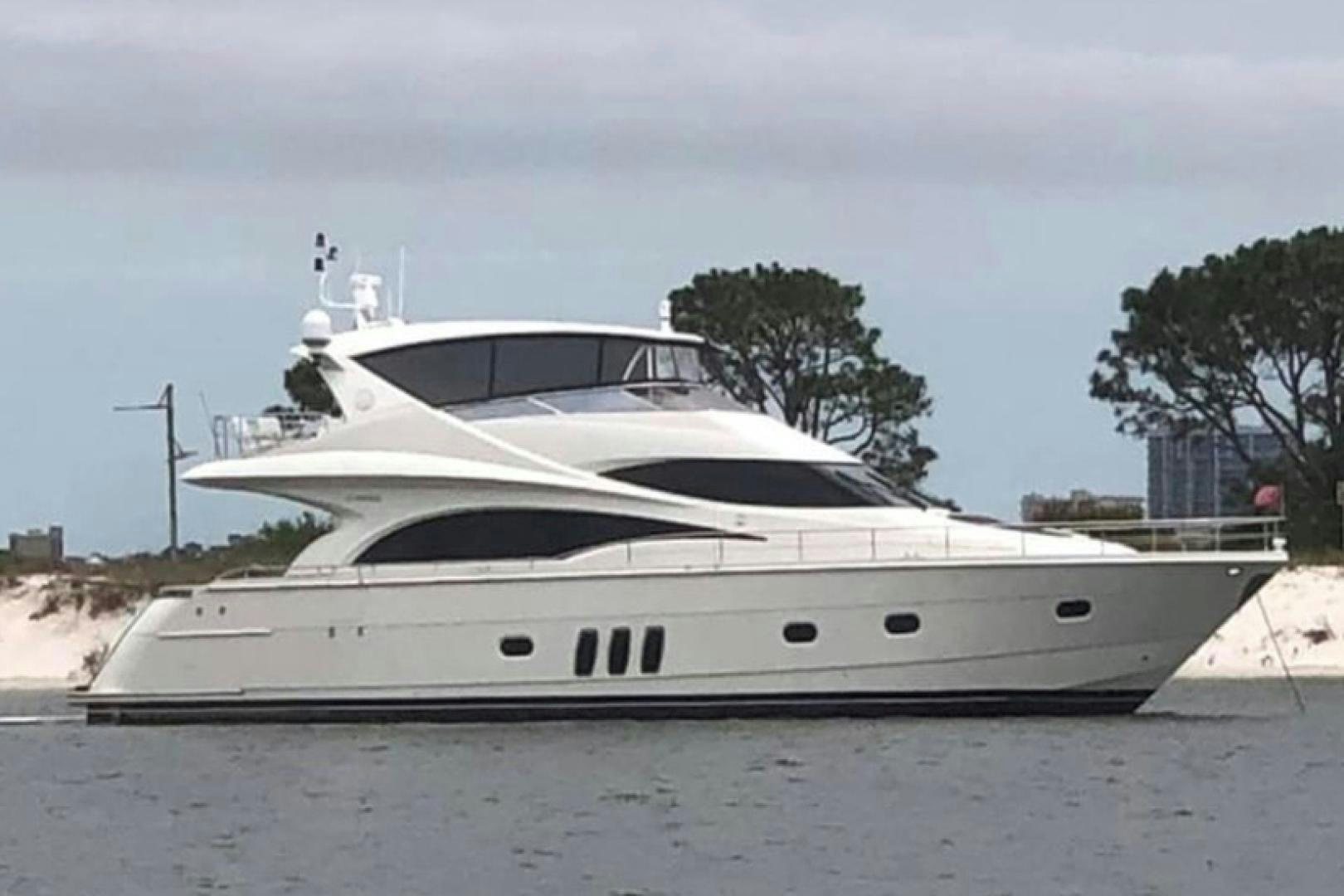 a white yacht on a beach aboard Gettin' There Yacht for Sale