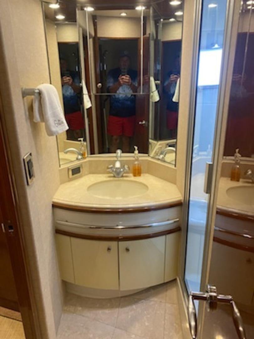 a bathroom with a sink and a mirror aboard Gettin' There Yacht for Sale