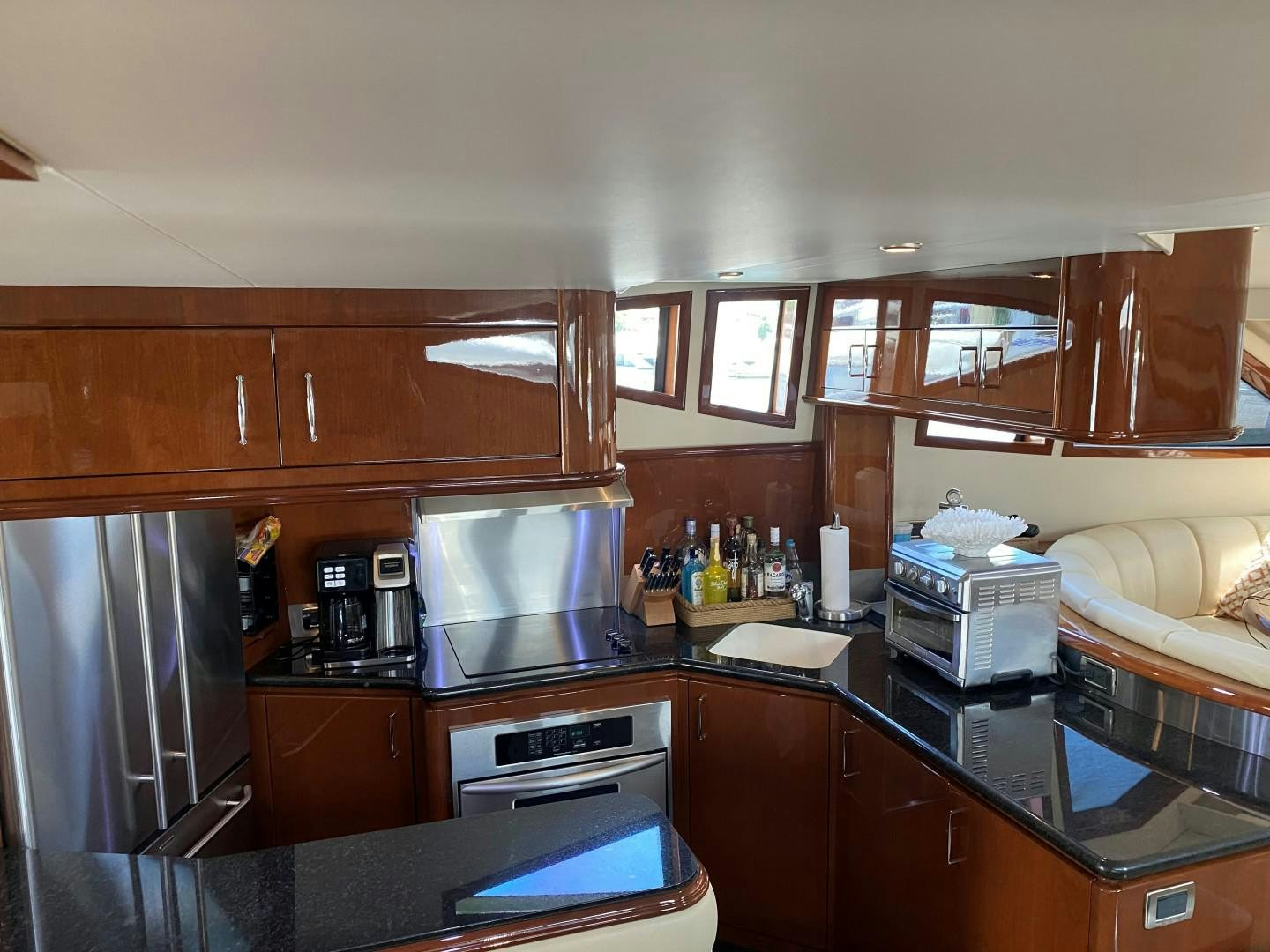 a kitchen with wooden cabinets aboard Gettin' There Yacht for Sale