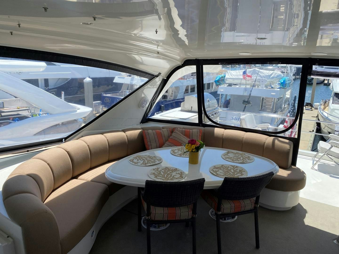 a table with plates and chairs on it aboard Gettin' There Yacht for Sale