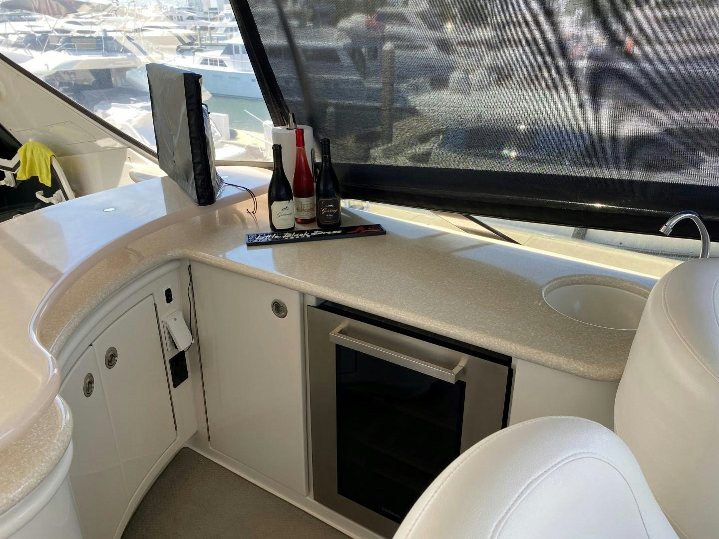a white kitchen with a window aboard Gettin' There Yacht for Sale