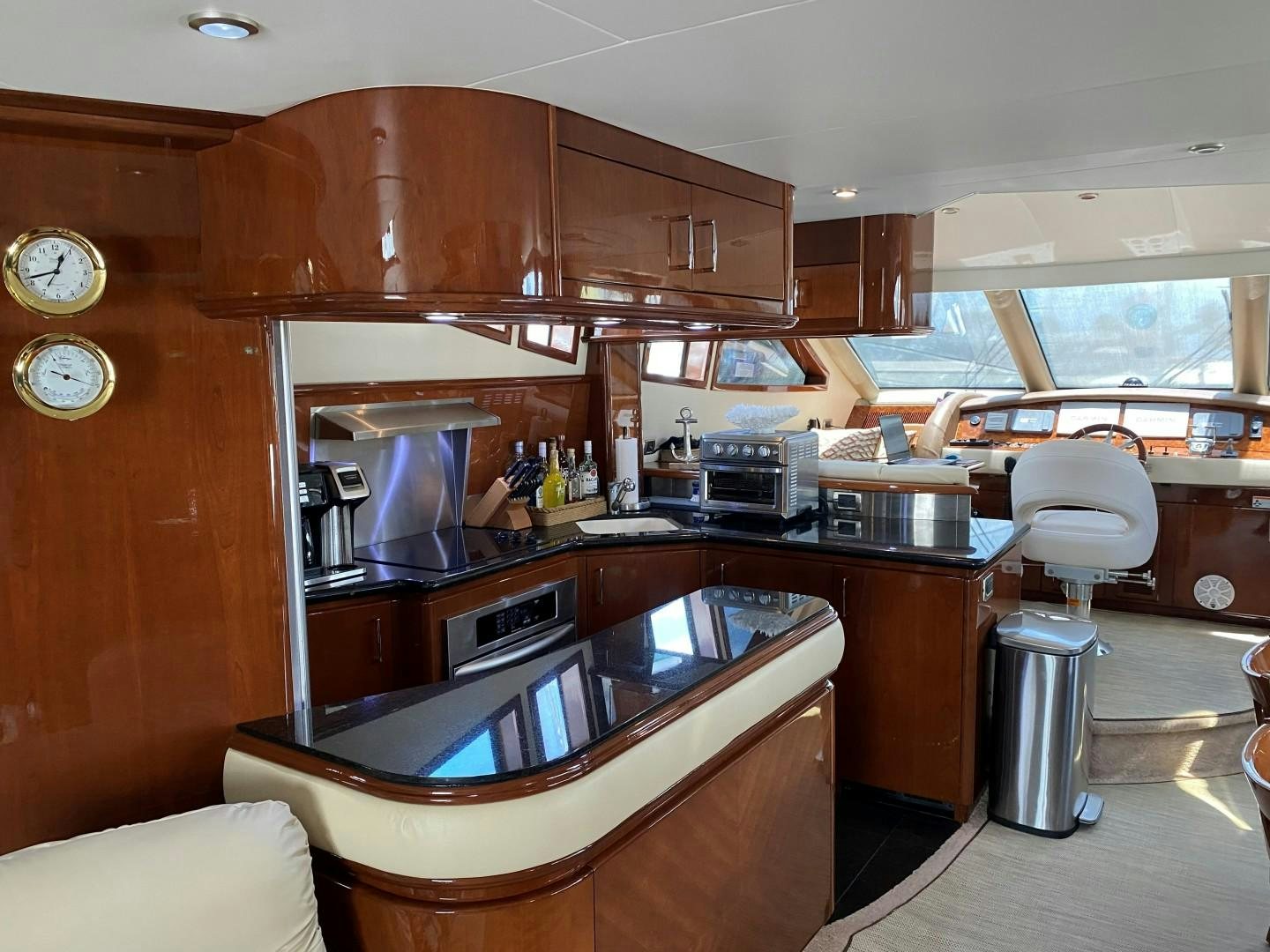 a kitchen with wooden cabinets aboard Gettin' There Yacht for Sale