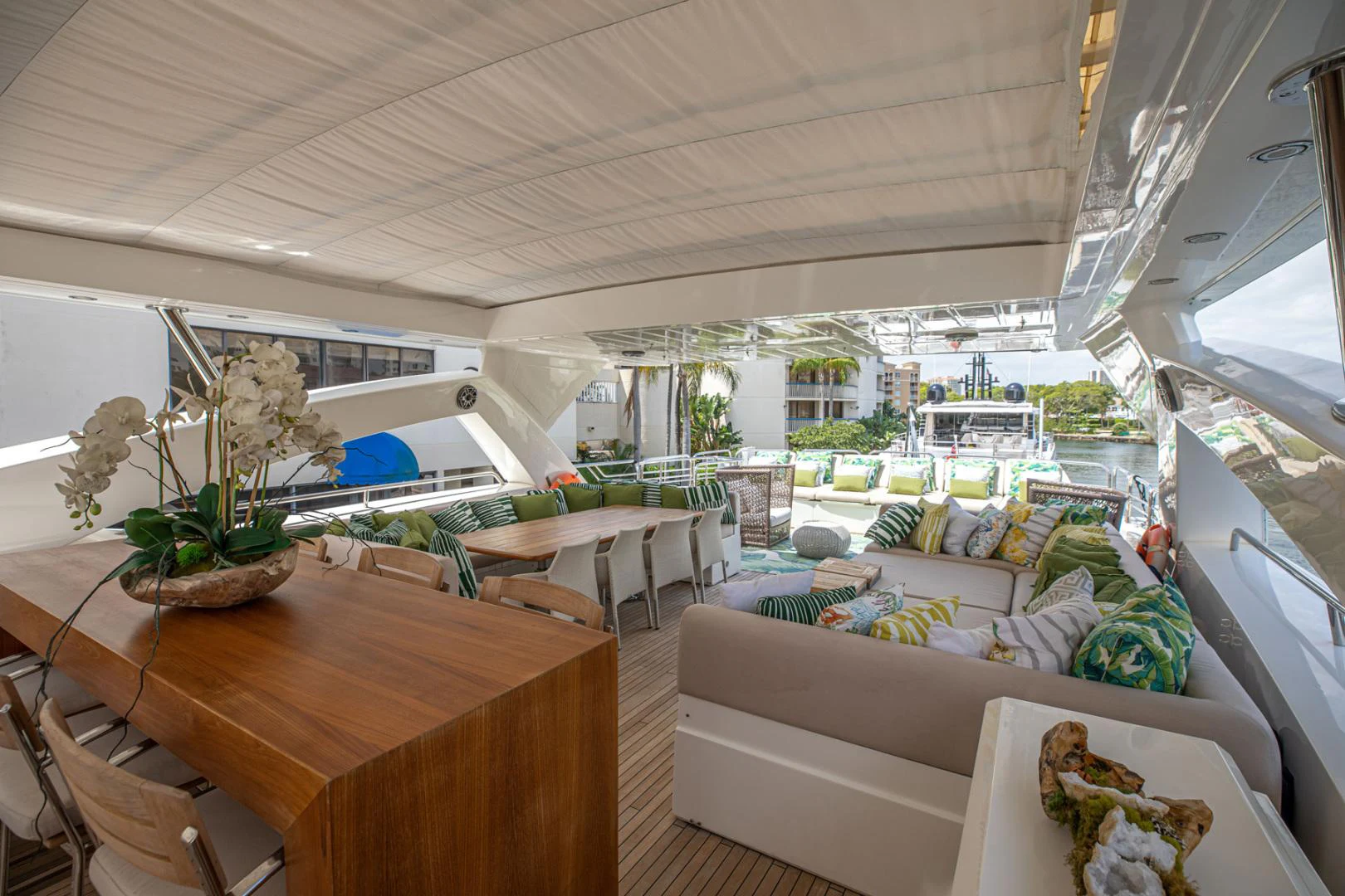 a room with a table and chairs aboard LE SORELLE III Yacht for Sale