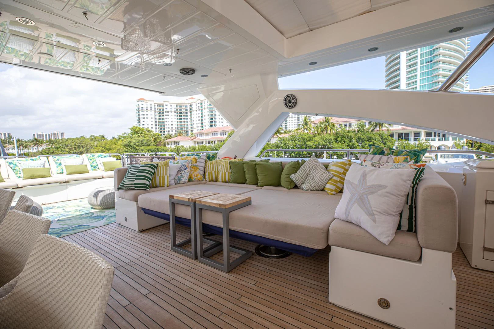 a living room with a couch and a table aboard LE SORELLE III Yacht for Sale