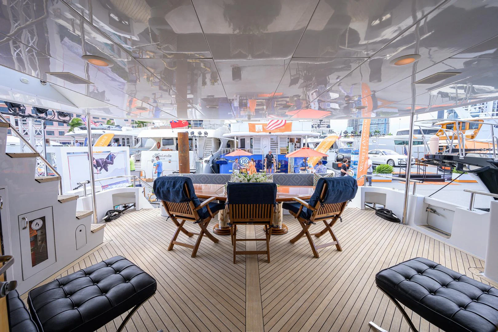 a room with a table chairs and a couch aboard MEMORYMAKER Yacht for Sale