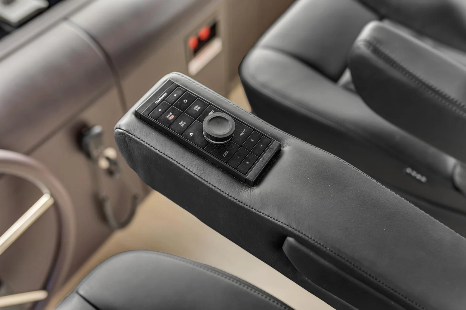 a black phone on a seat aboard CARBON COPY Yacht for Sale