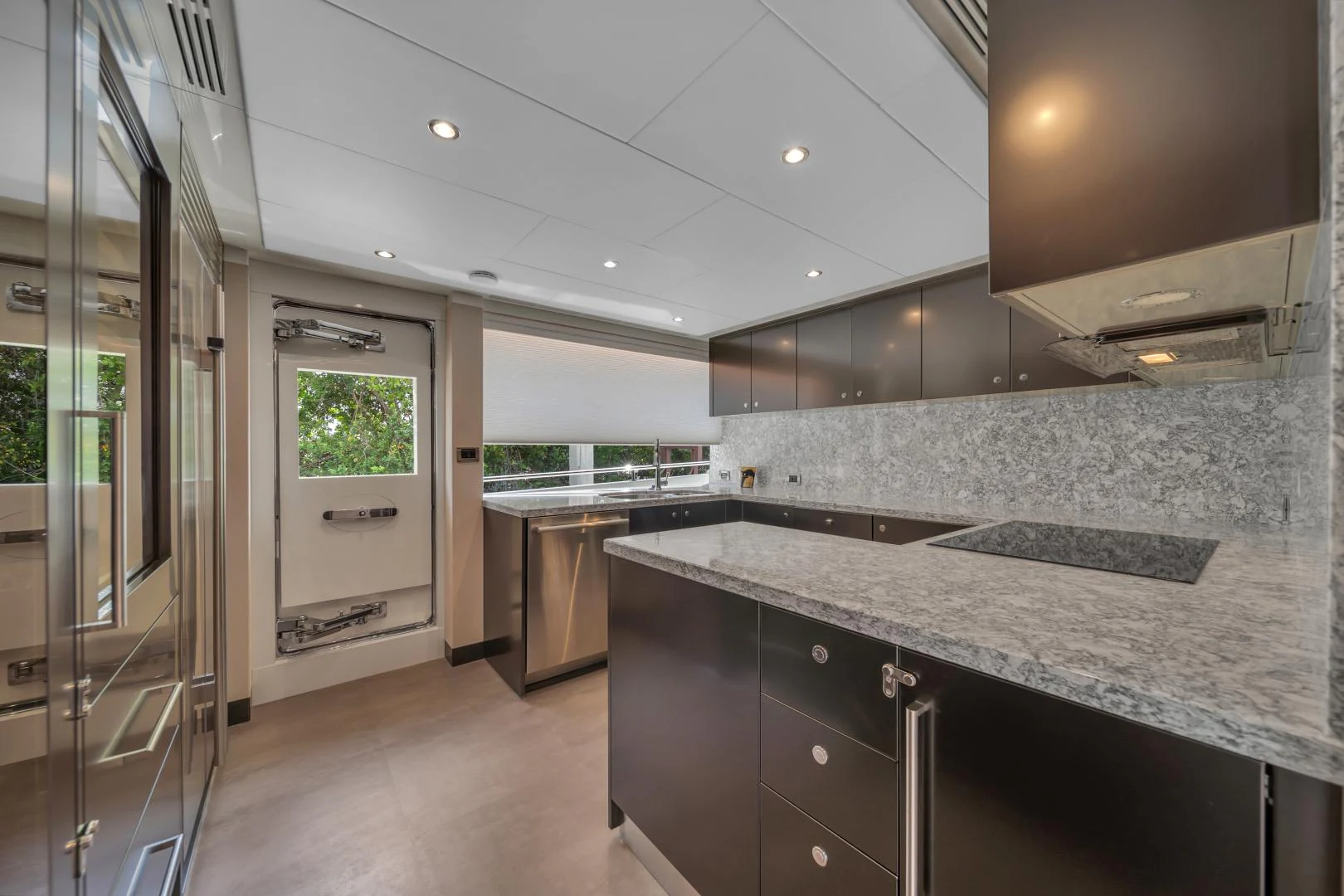 a kitchen with marble counter tops aboard CARBON COPY Yacht for Sale