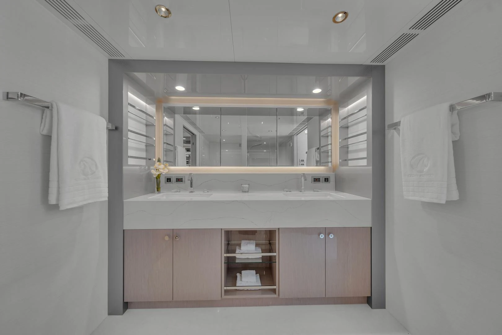 a bathroom with a sink and mirror aboard CARBON COPY Yacht for Sale