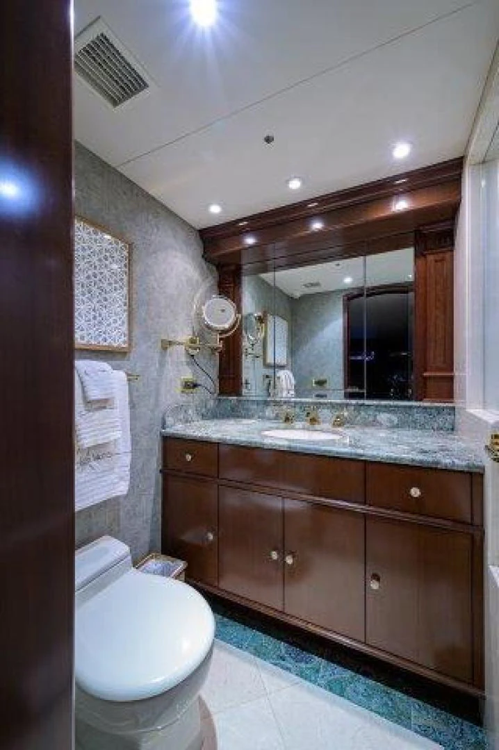 a bathroom with a large mirror aboard REBECCA Yacht for Sale
