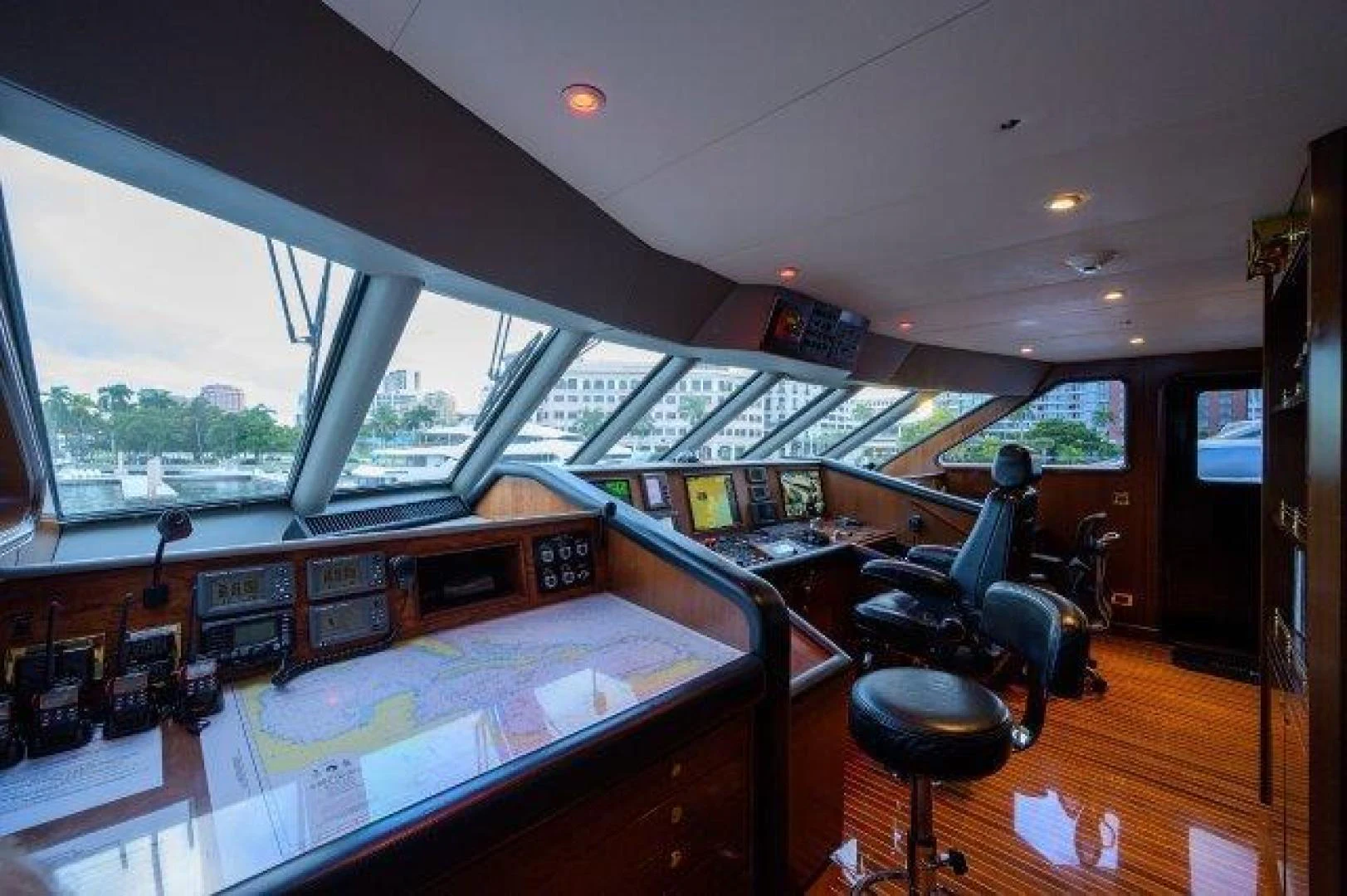a room with a large window and a table with chairs and a large window aboard REBECCA Yacht for Sale