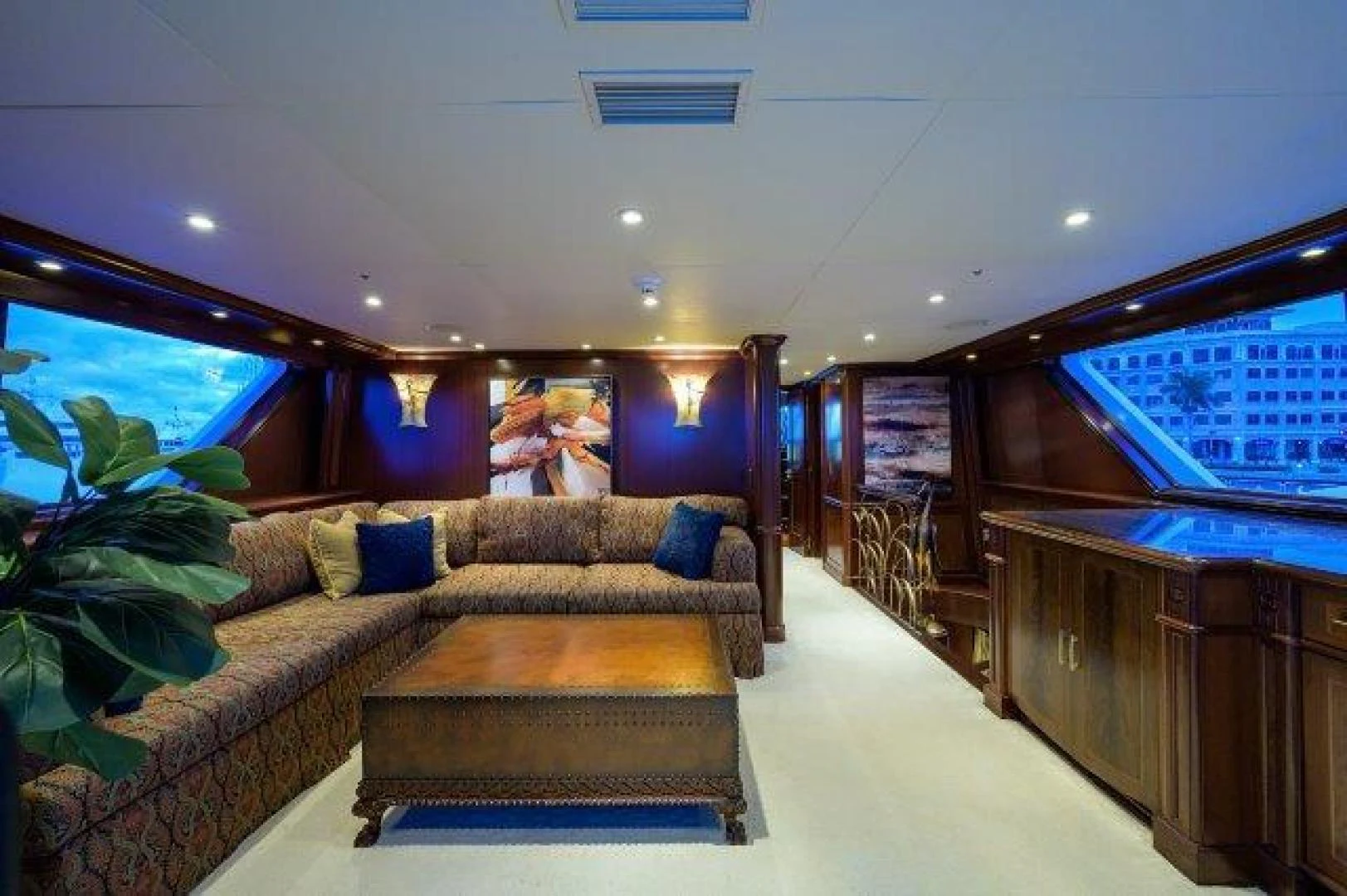 a living room with a couch and a coffee table aboard REBECCA Yacht for Sale