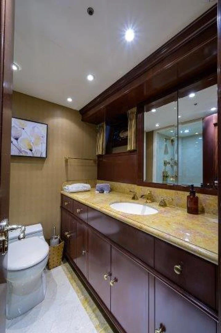 a bathroom with a large mirror aboard REBECCA Yacht for Sale