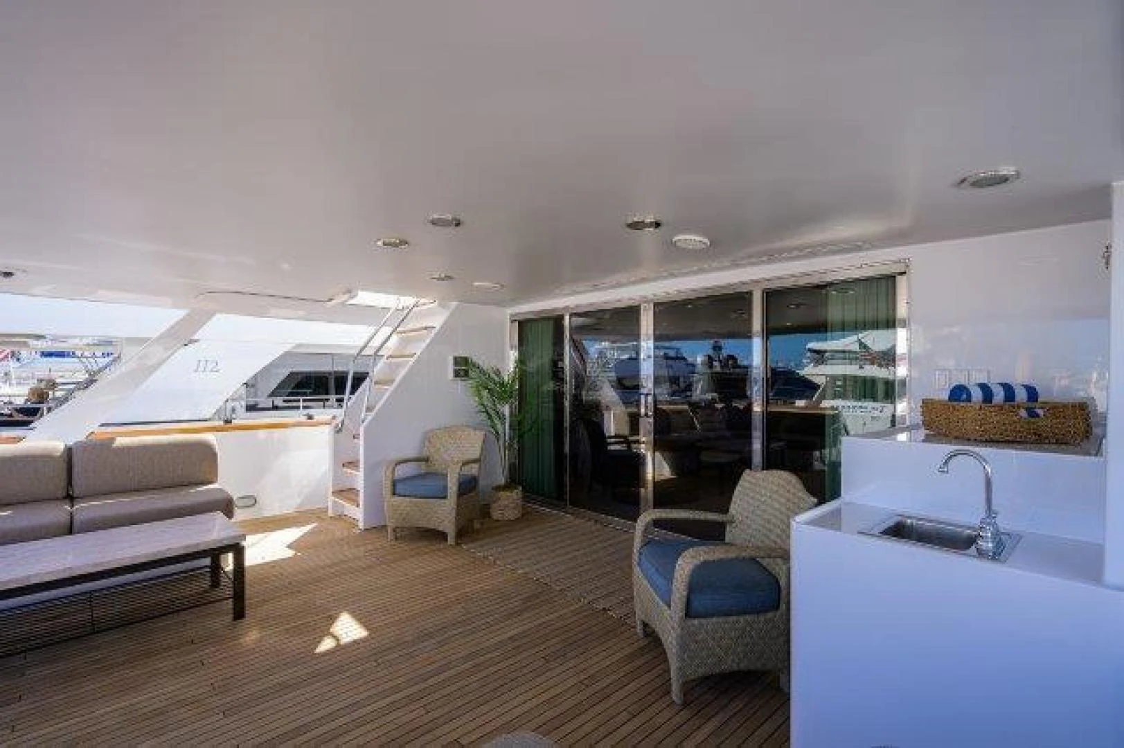 a living room with a wood floor aboard REBECCA Yacht for Sale