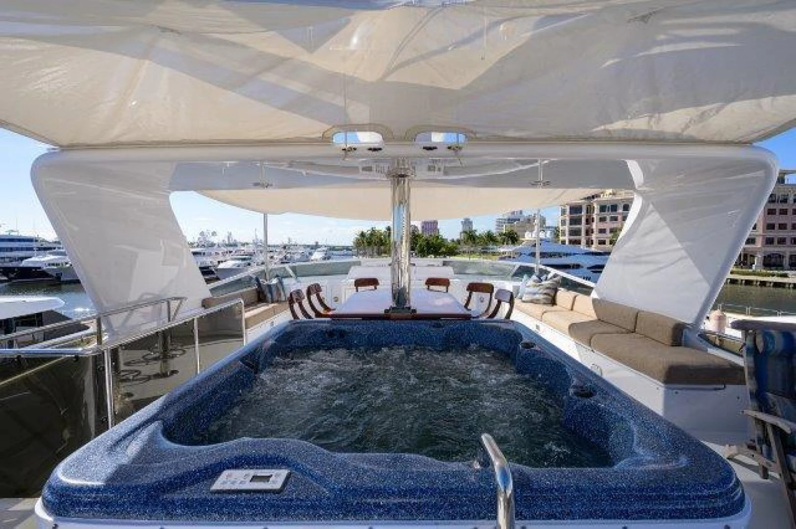 a tent with a couch and chairs aboard REBECCA Yacht for Sale