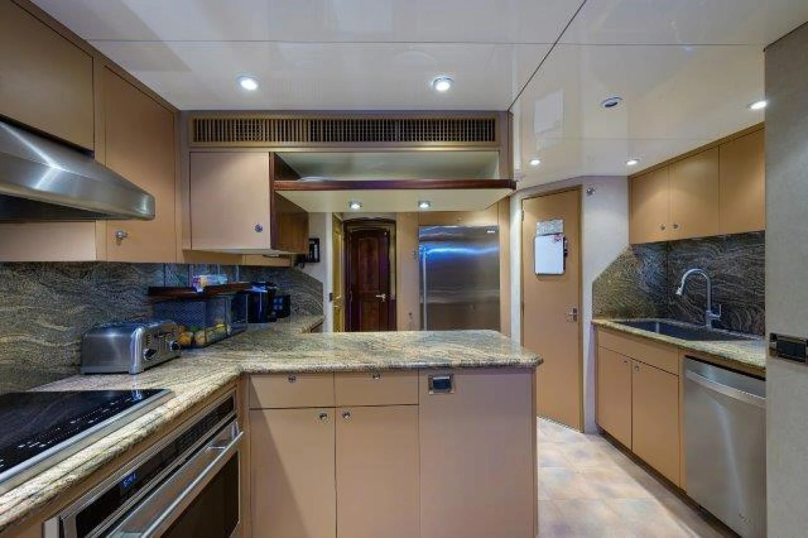 a kitchen with a sink and stove aboard REBECCA Yacht for Sale