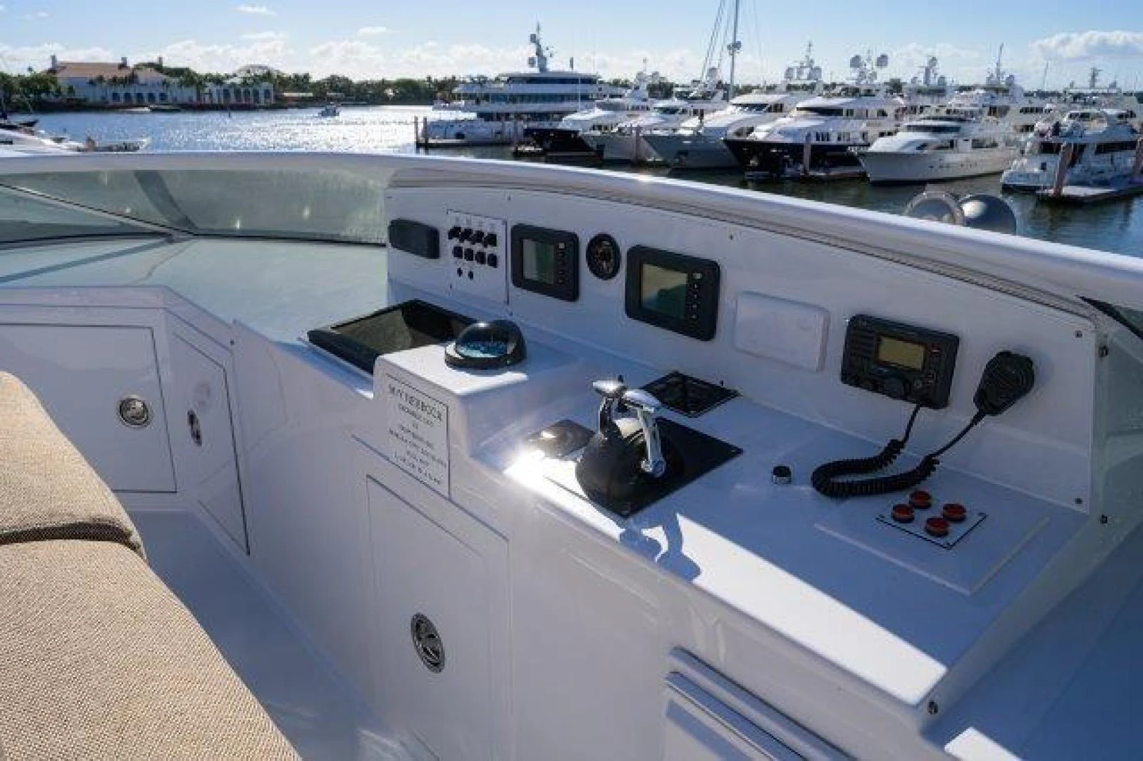 a white yacht in a harbor aboard REBECCA Yacht for Sale