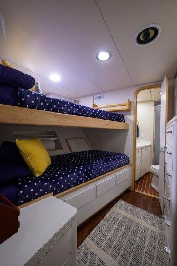 a bed in a room aboard REBECCA Yacht for Sale