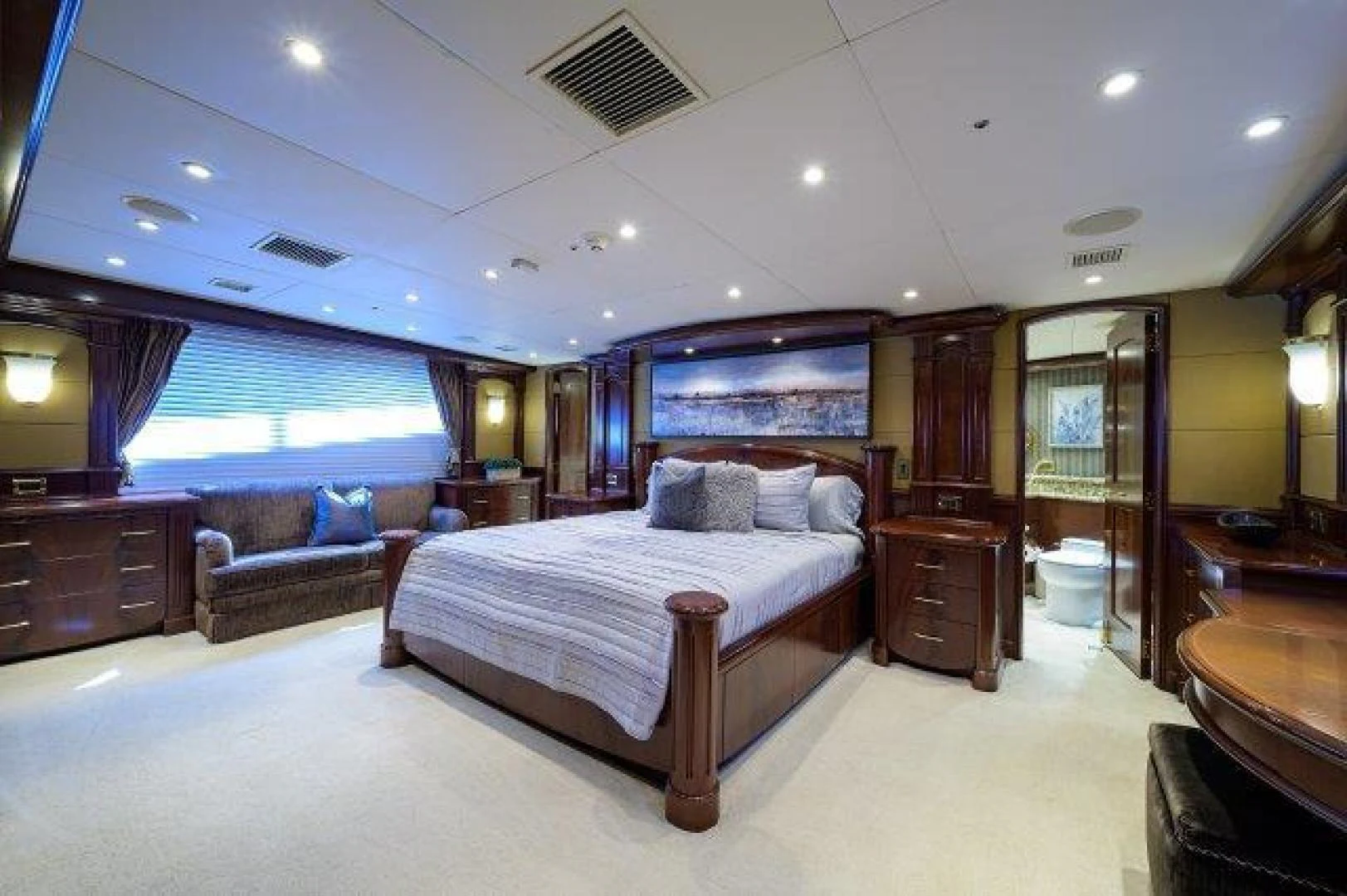 a large bedroom with a bed aboard REBECCA Yacht for Sale