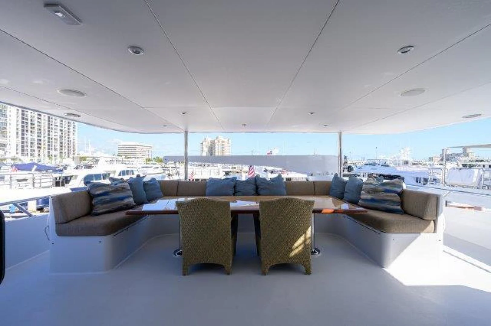 a room with couches and a table aboard REBECCA Yacht for Sale