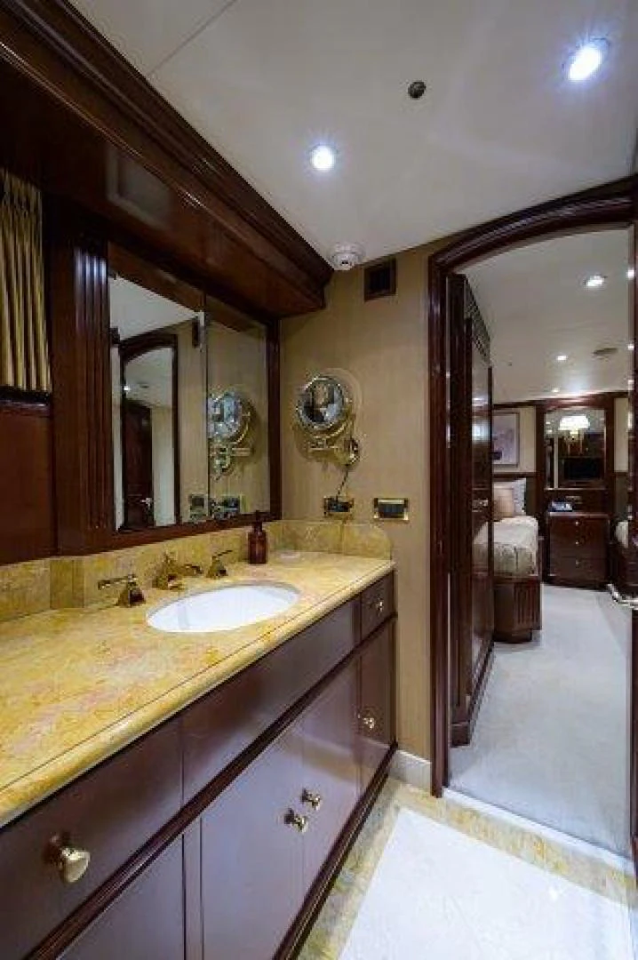 a bathroom with a sink and a mirror aboard REBECCA Yacht for Sale