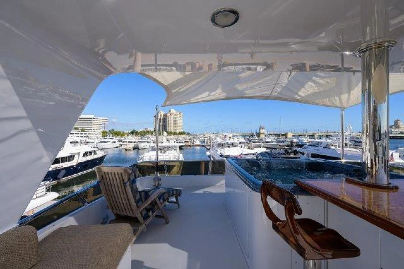 a room with a view of a city and a large blue building aboard REBECCA Yacht for Sale