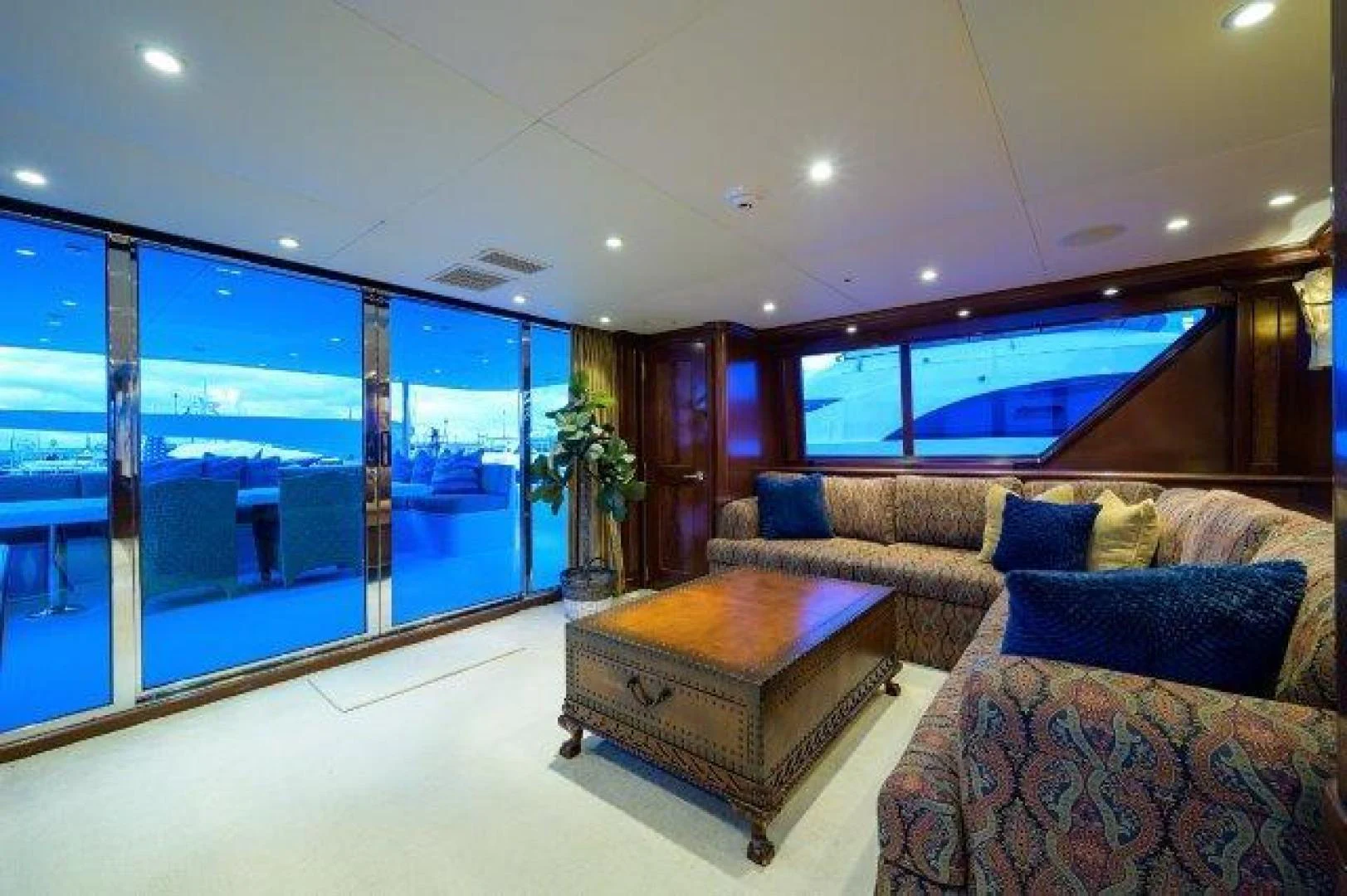 a living room with a large glass window aboard REBECCA Yacht for Sale