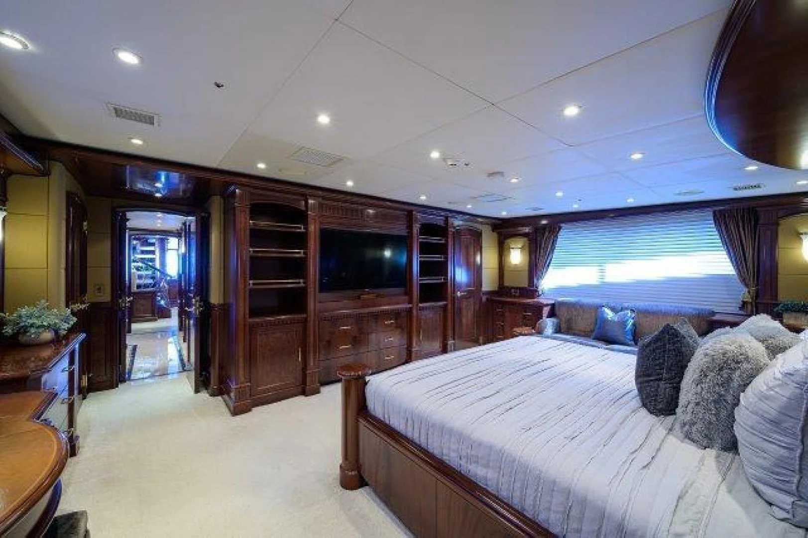 a bedroom with a bed and a television aboard REBECCA Yacht for Sale