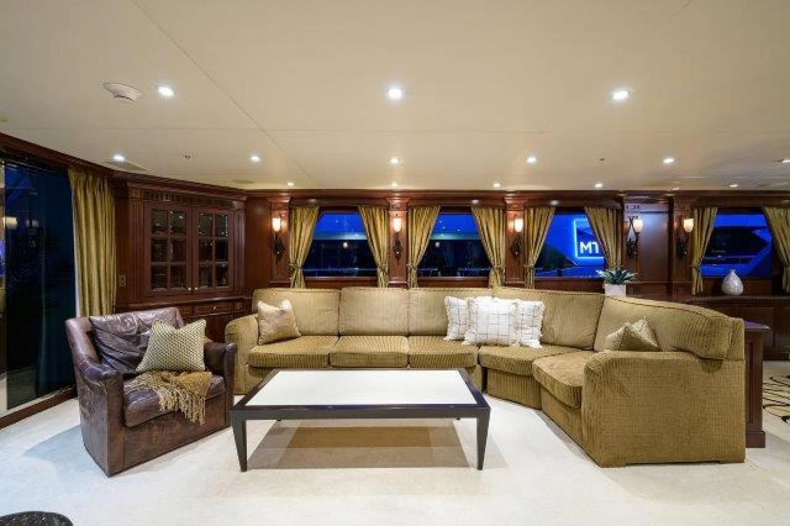 a living room with a large window aboard REBECCA Yacht for Sale