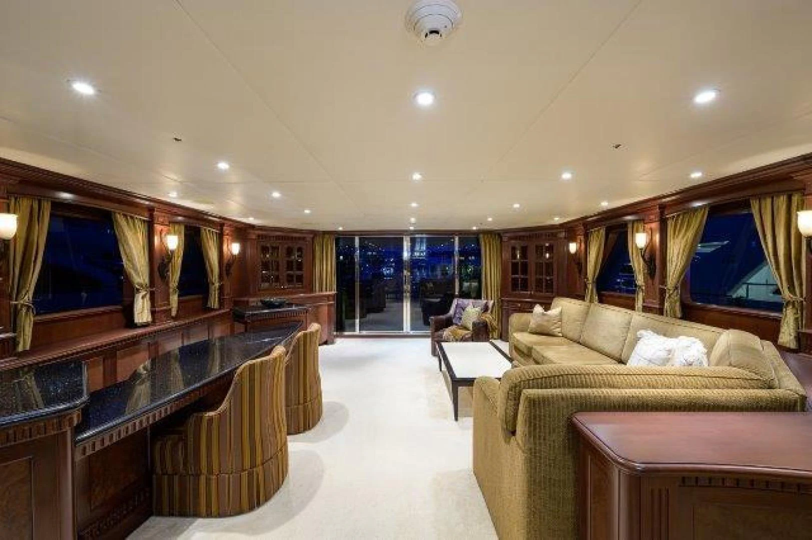 a large living room with a large bed and a large window aboard REBECCA Yacht for Sale