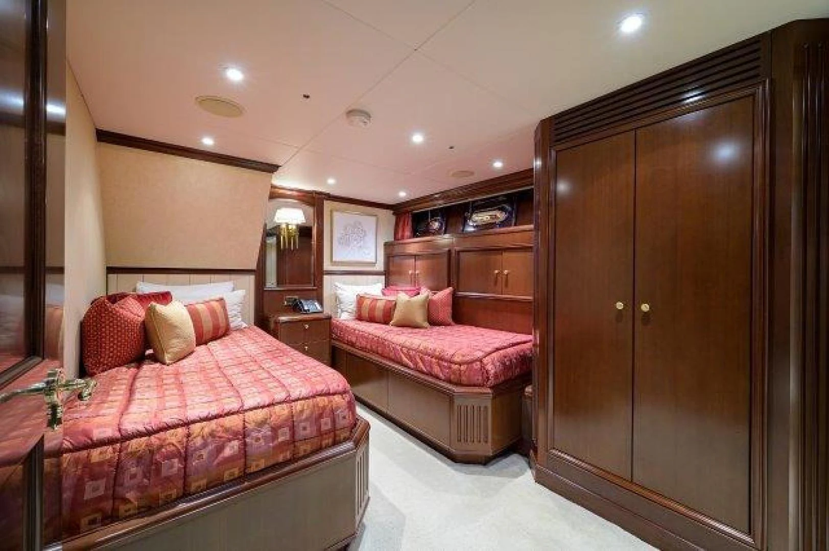 a bedroom with a bed and a closet aboard REBECCA Yacht for Sale