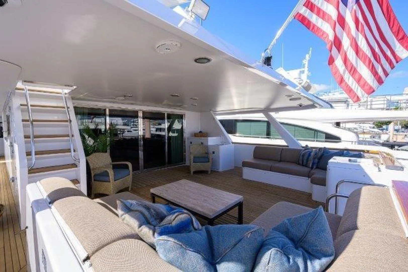 a room with a deck and a view of the water aboard REBECCA Yacht for Sale