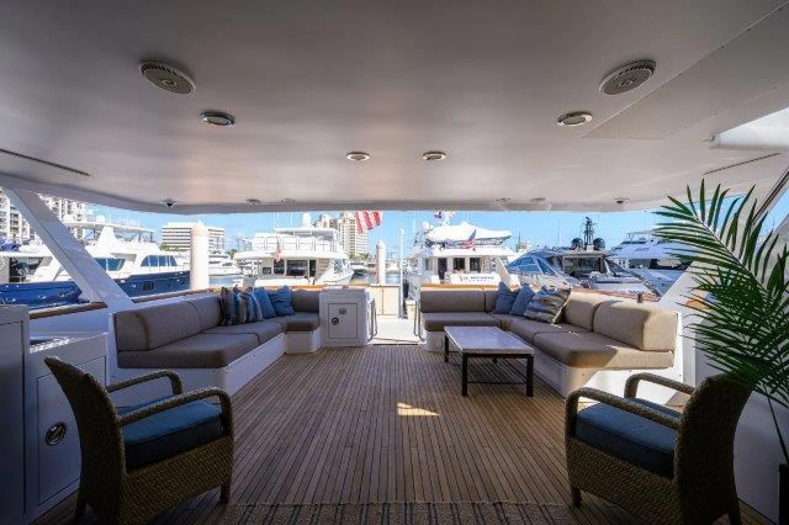 a large living room with a view of the ocean and the ocean aboard REBECCA Yacht for Sale