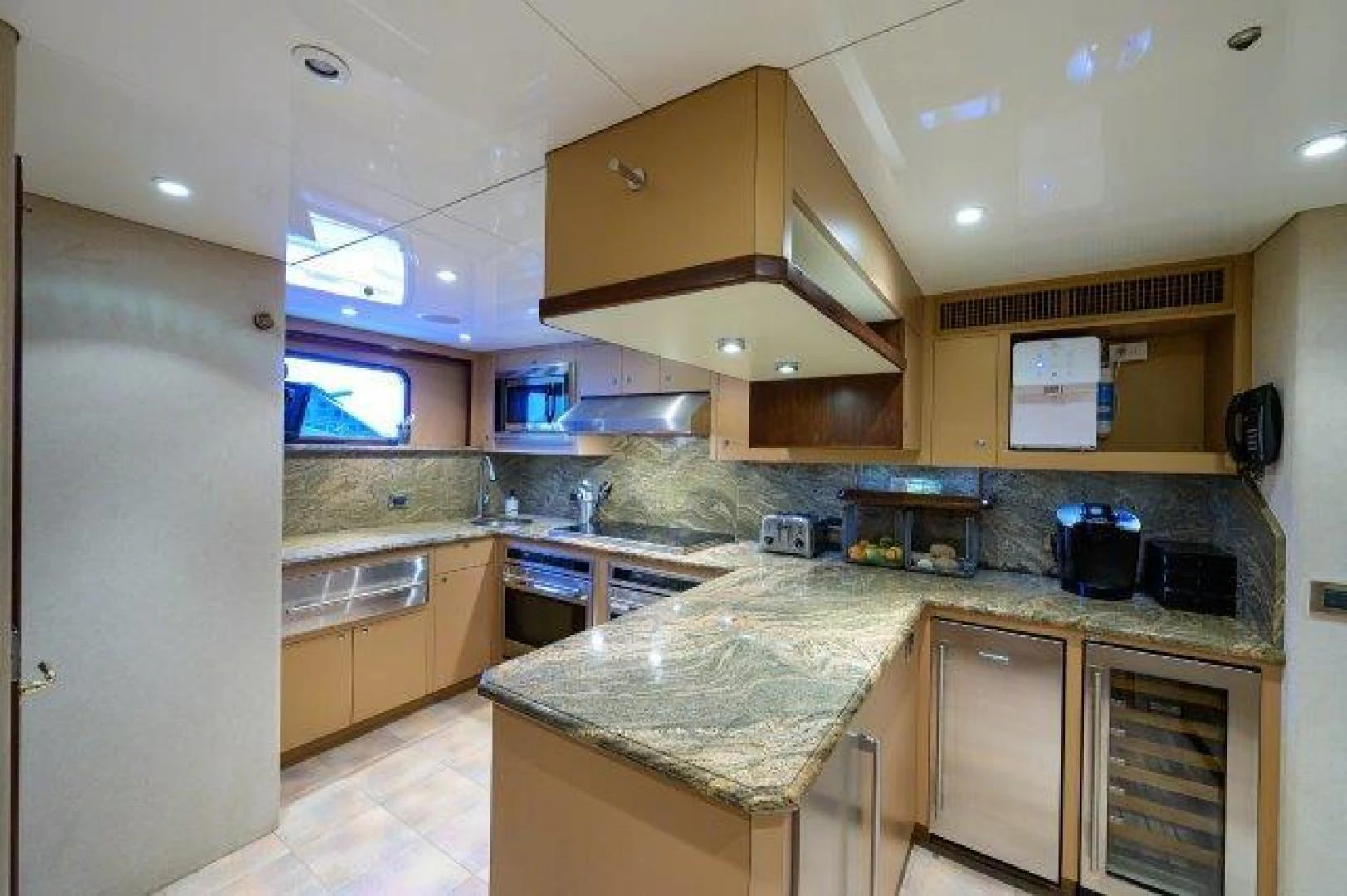 a kitchen with a large island aboard REBECCA Yacht for Sale