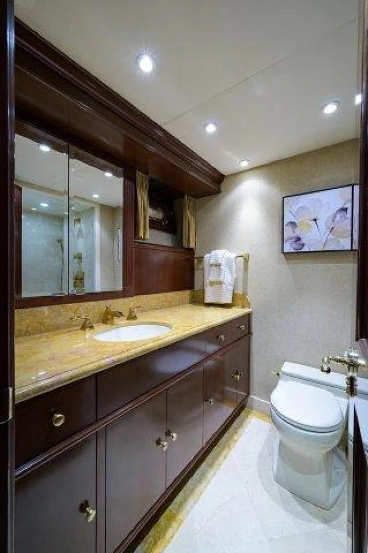 a bathroom with a large mirror aboard REBECCA Yacht for Sale