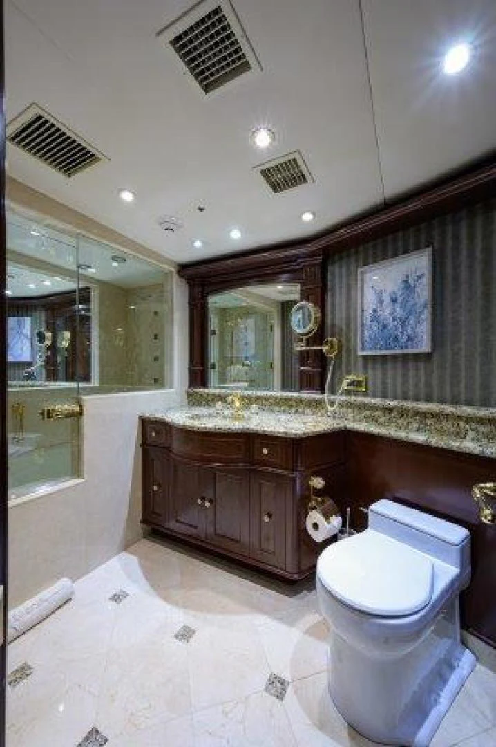 a bathroom with a large mirror aboard REBECCA Yacht for Sale