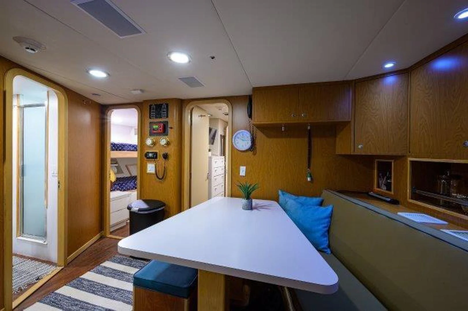 a kitchen with a table and chairs aboard REBECCA Yacht for Sale