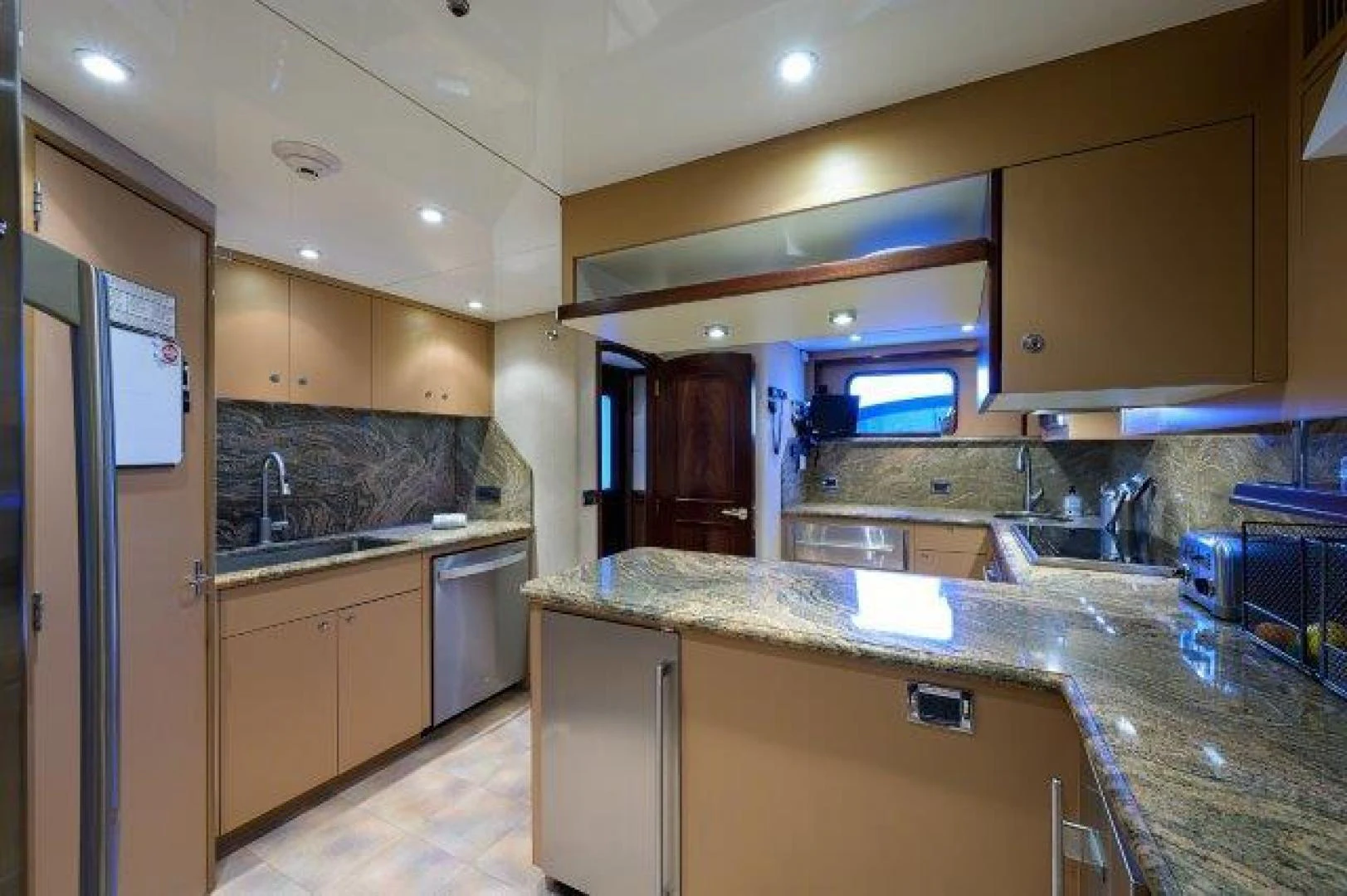 a kitchen with a marble counter top aboard REBECCA Yacht for Sale