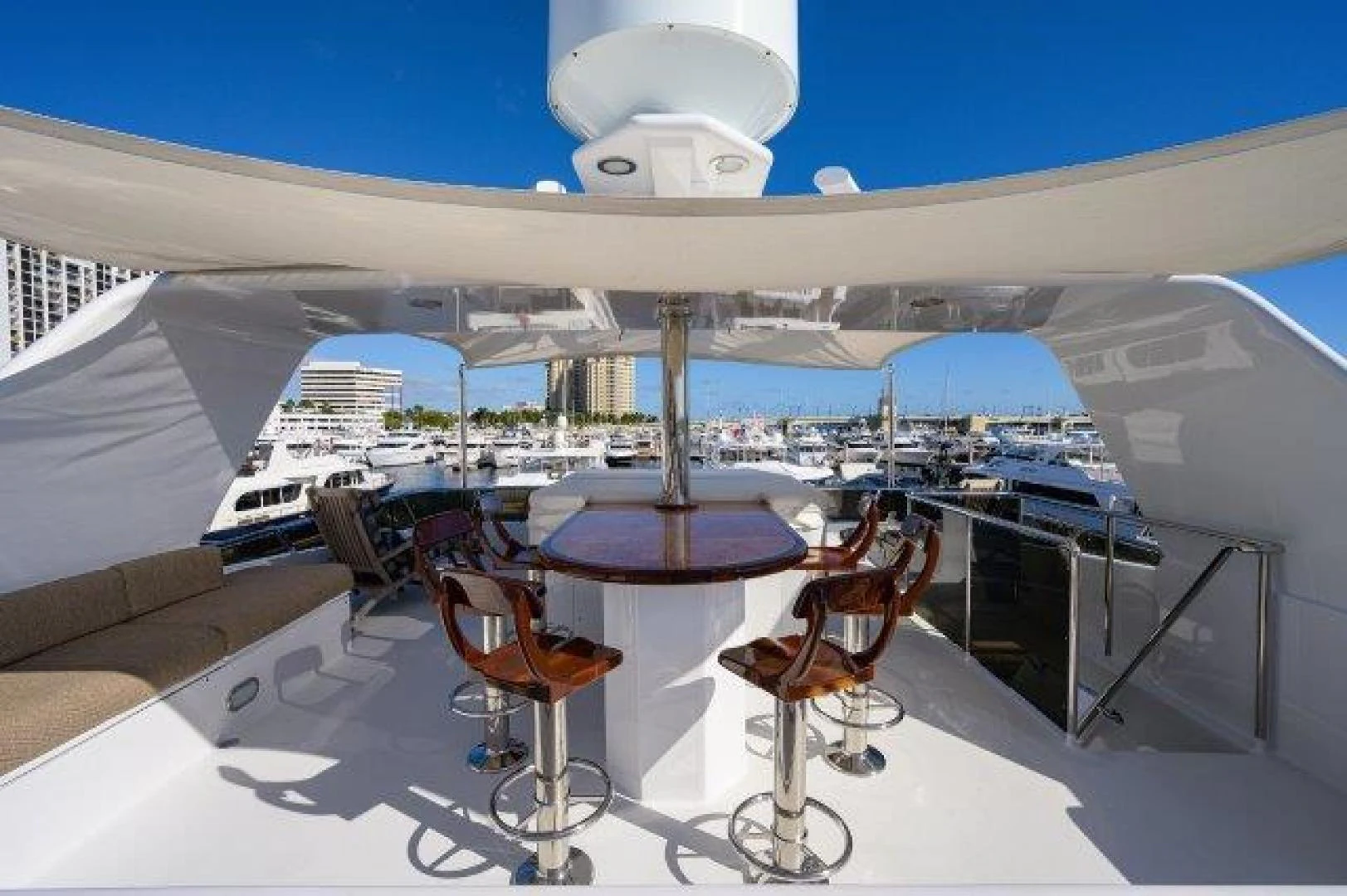 a table and chairs on a deck aboard REBECCA Yacht for Sale