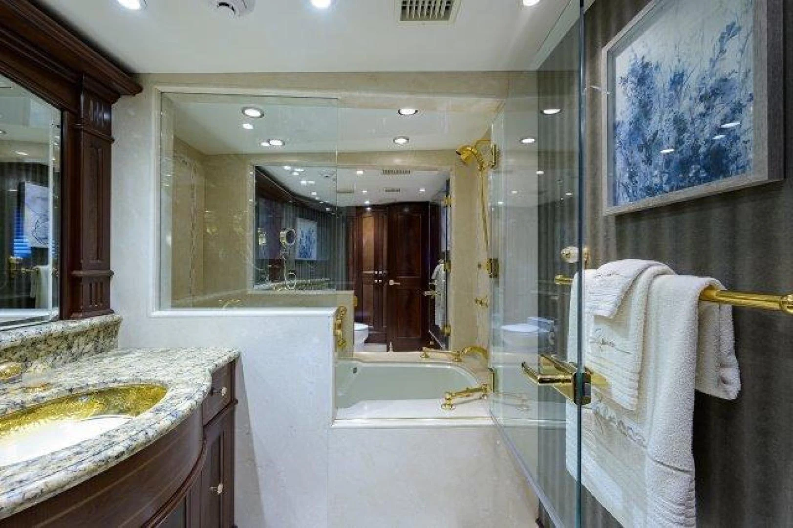 a bathroom with a large mirror aboard REBECCA Yacht for Sale