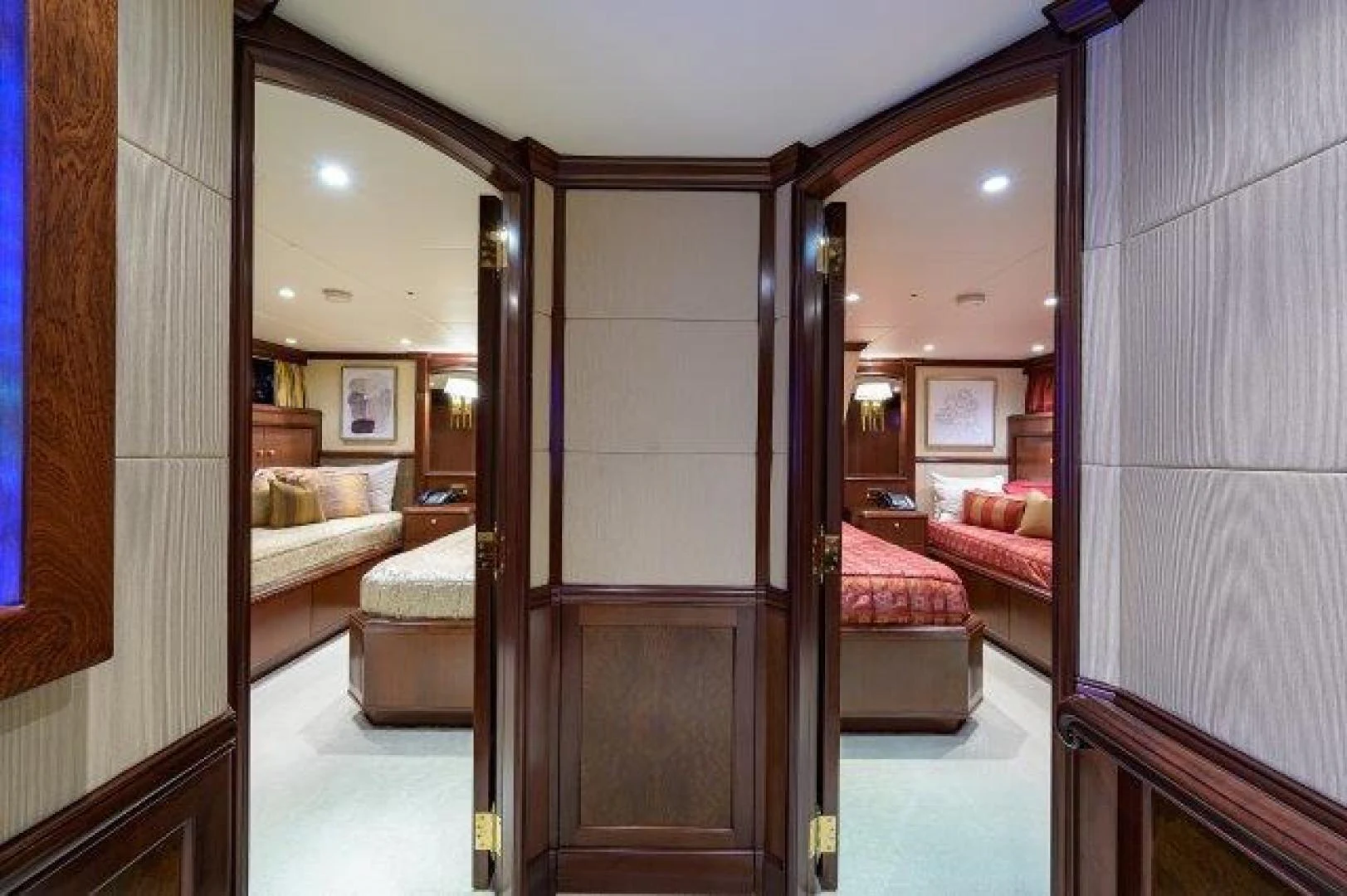 a room with a bed and a mirror aboard REBECCA Yacht for Sale