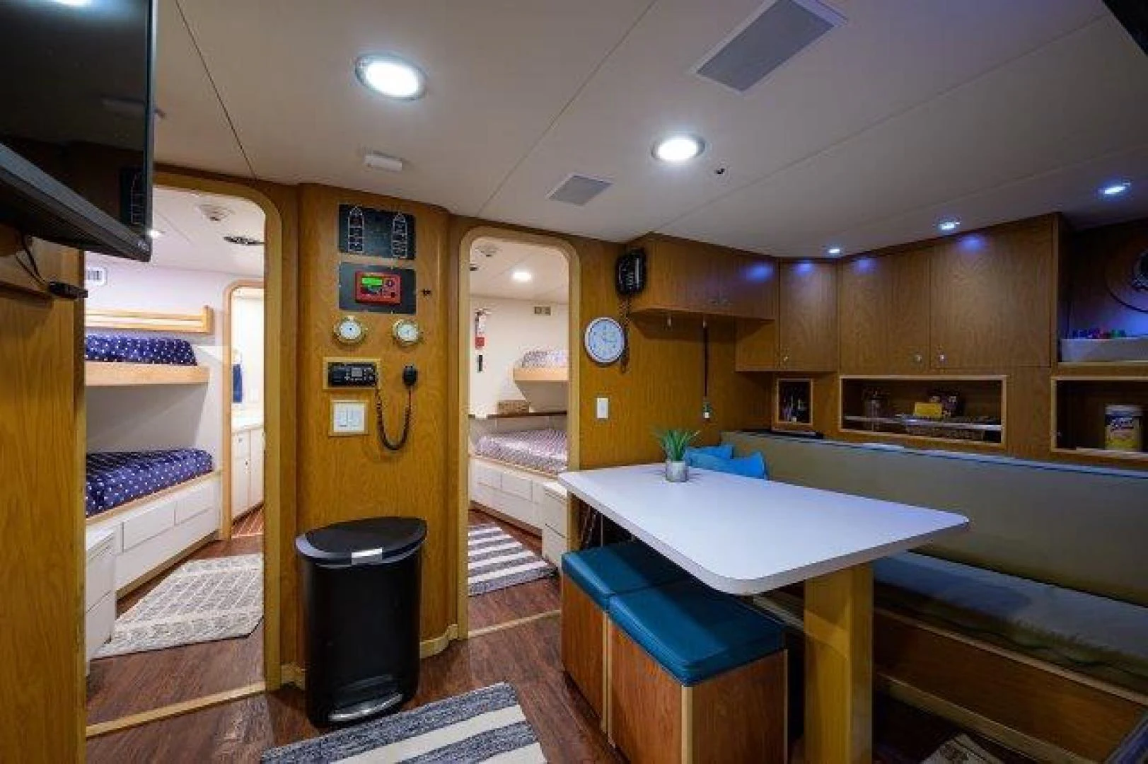 a room with a desk and a bed aboard REBECCA Yacht for Sale